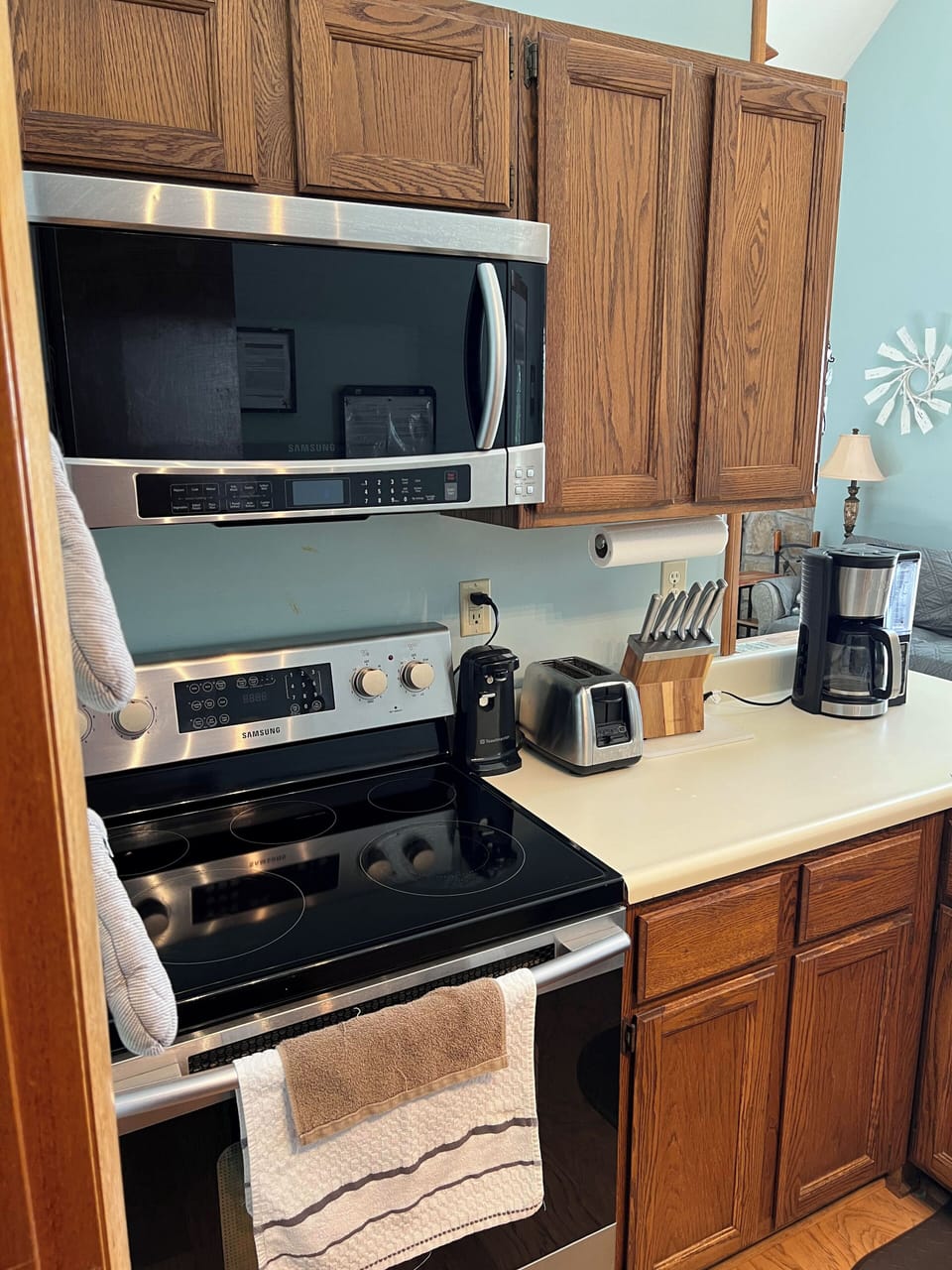 Glass top Stove/ oven and microwave. Electric can opener and coffee maker