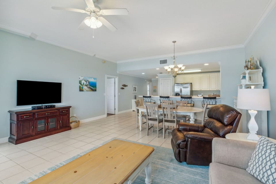 Living Area with Flat Screen TV and Access to Private Covered Balcony (Queen Sleeper Sofa)