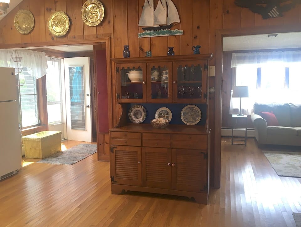 Kitchen opens to back door area (washer/dryer location) & den/tv room to  right