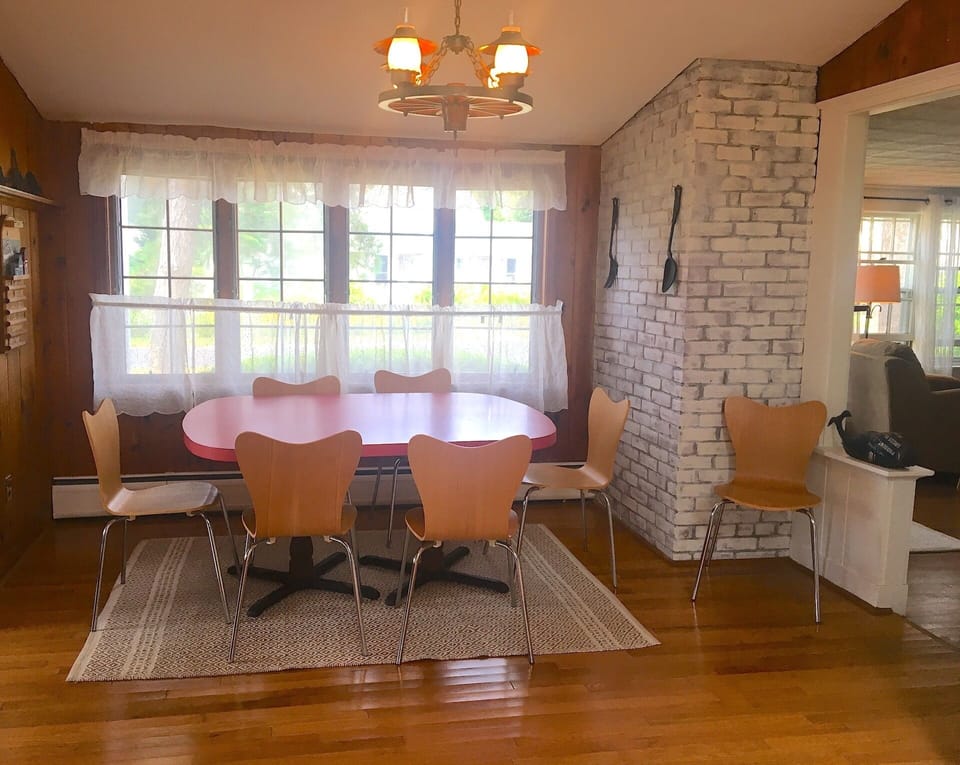 View of kitchen dining area, with adjacent row of windows