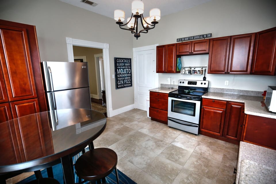 Full sized refrigerator, glass top stove and above the range microwave. 