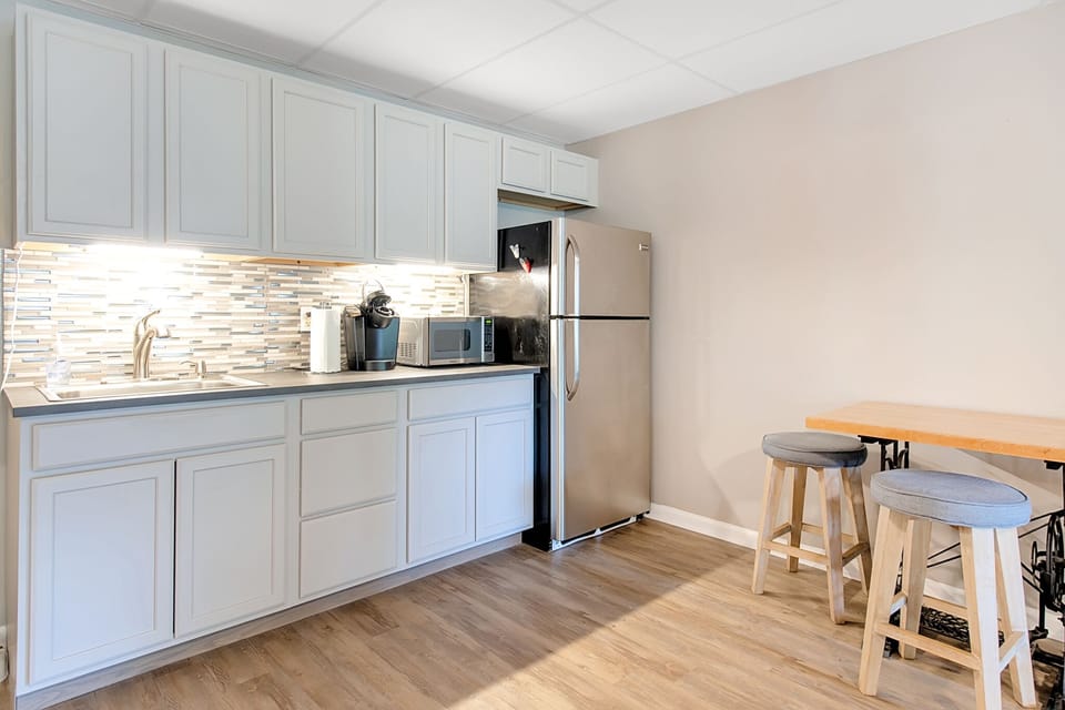 The basement is set up nicely, kitchenette  with sink, microwave, dishes Frig.