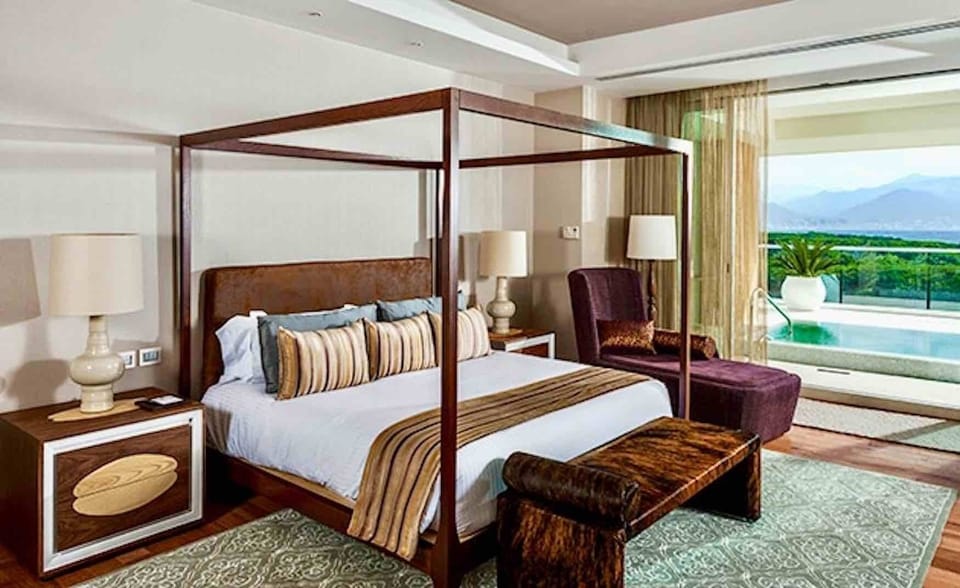 Master bedroom. Plunge Pool on Deck can be seen through patio door