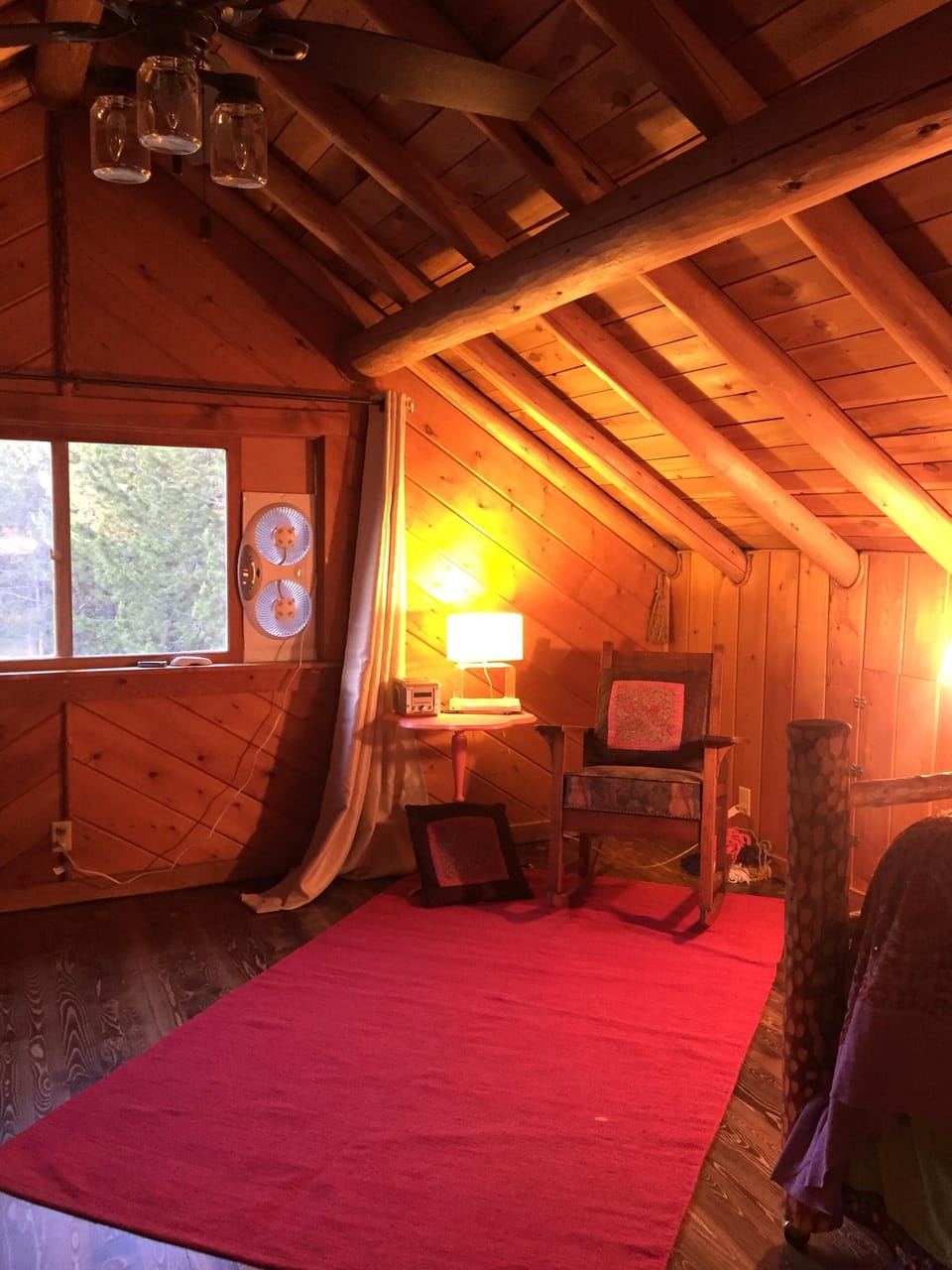 Upstairs loft bedroom which sleeps seven guests
