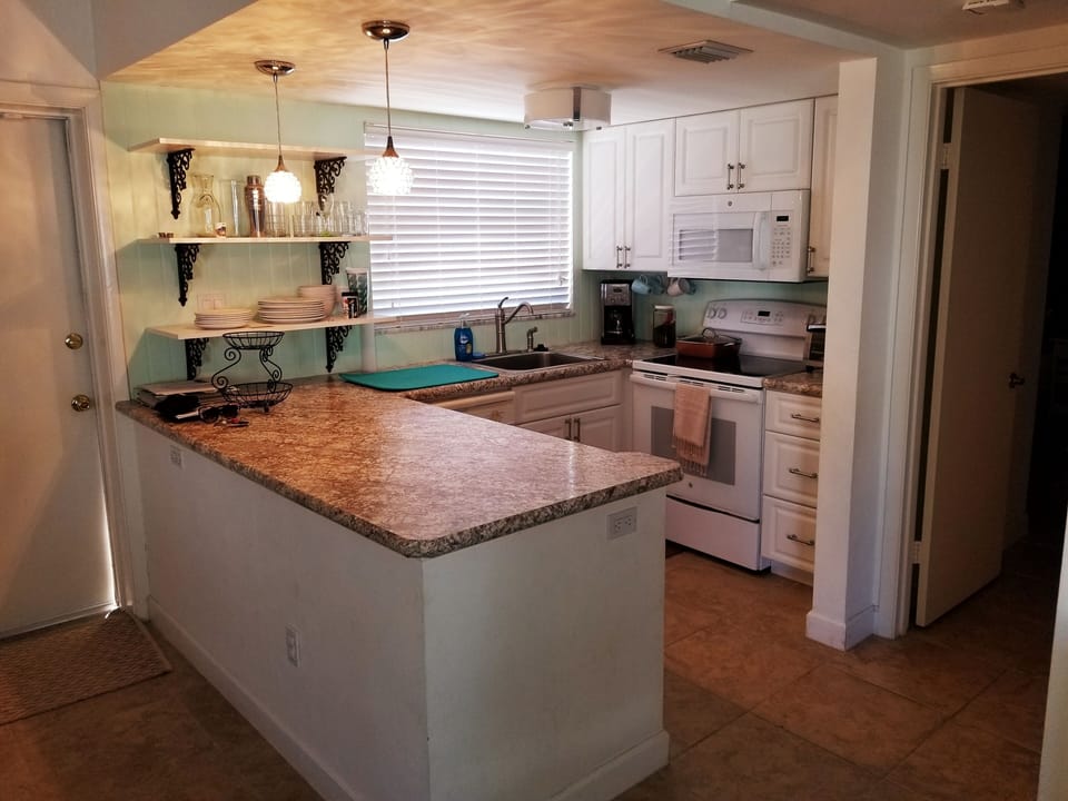 Full kitchen with dishwasher. 