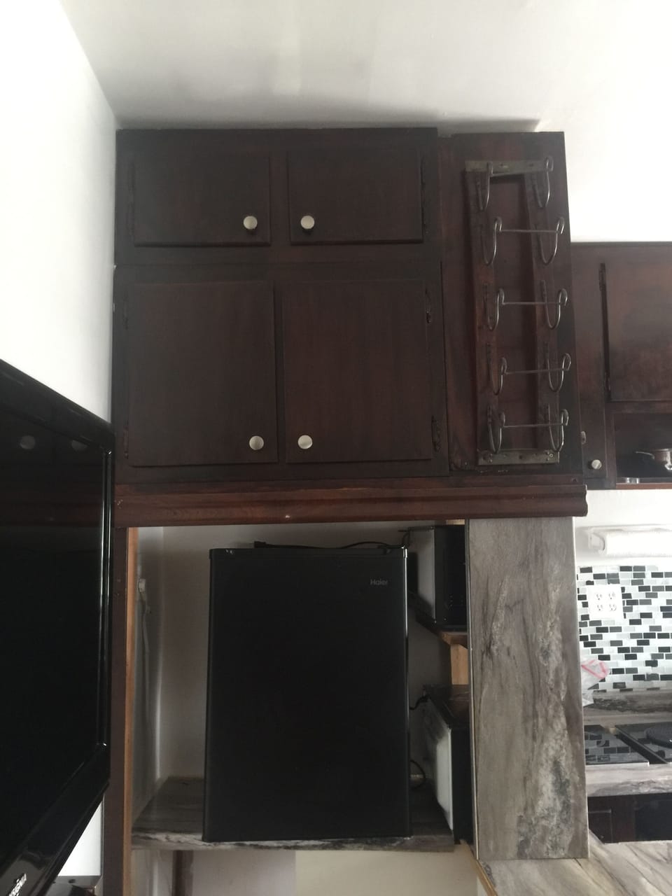 medium size refrigerator  and wine holder 