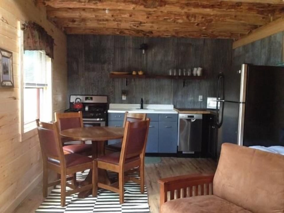 Kitchen has large window that looks out at the lake