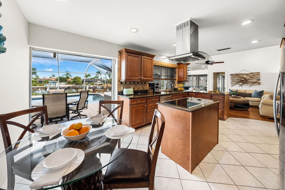 Start your day with a delightful breakfast and breathtaking views of the tranquil canal and inviting pool area