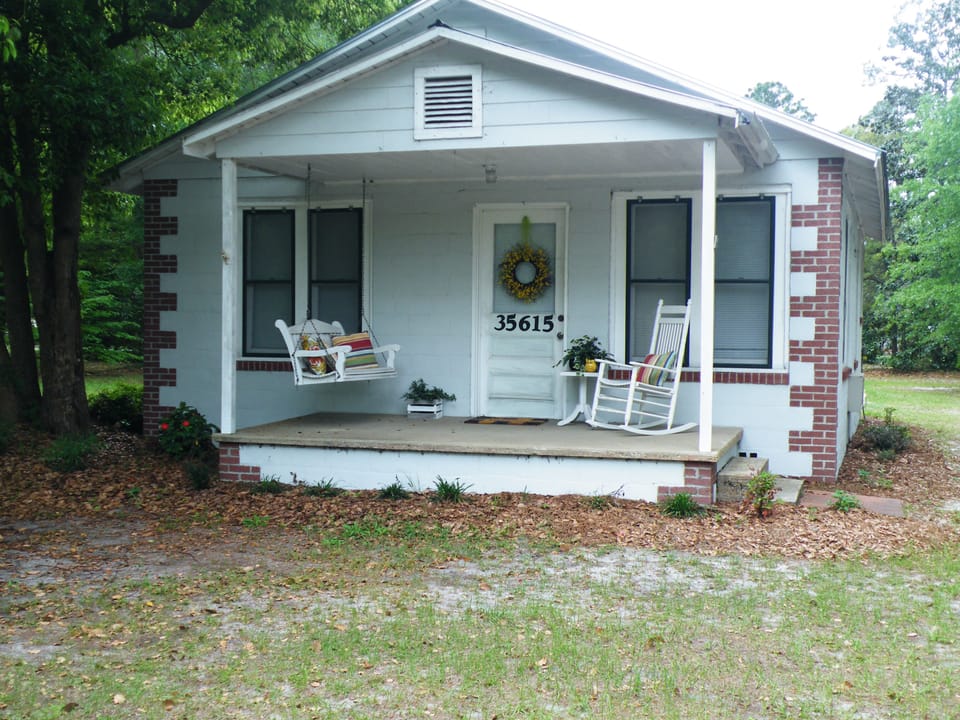 Front w/ swing and rocking chair
