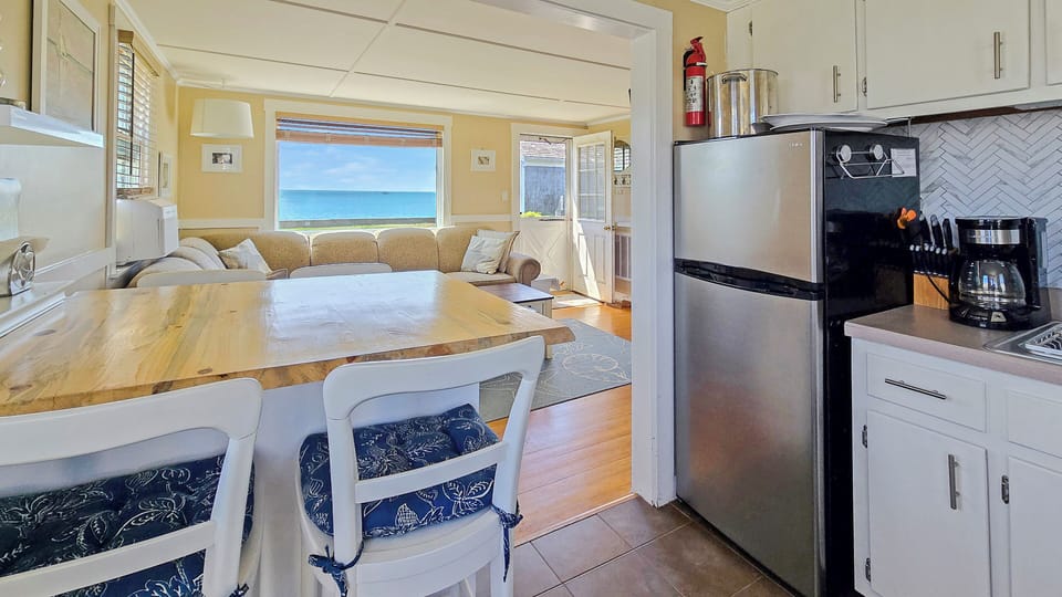 Kitchen with dining area and living room beyond