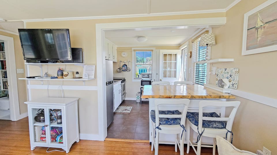 Living room with dining area and kitchen beyond