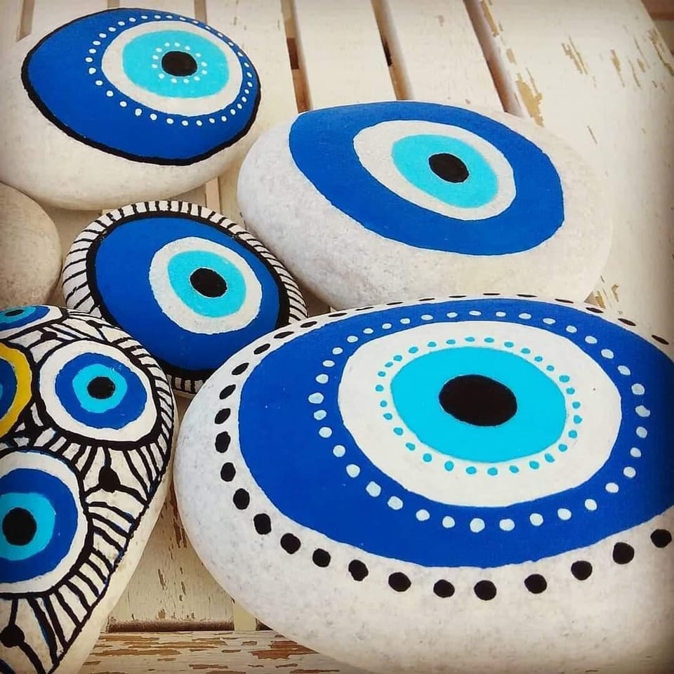Art stones painted at the accommodation by White Blue Art