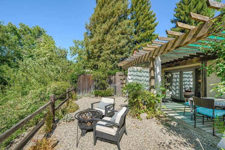 The creek and lots of trees back up to the deck making it feel wide open, sunny.