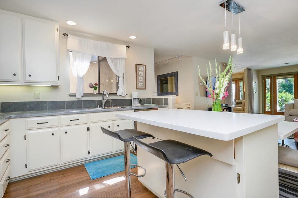 Open kitchen with all modern conveniences, new appliances, fully stocked.