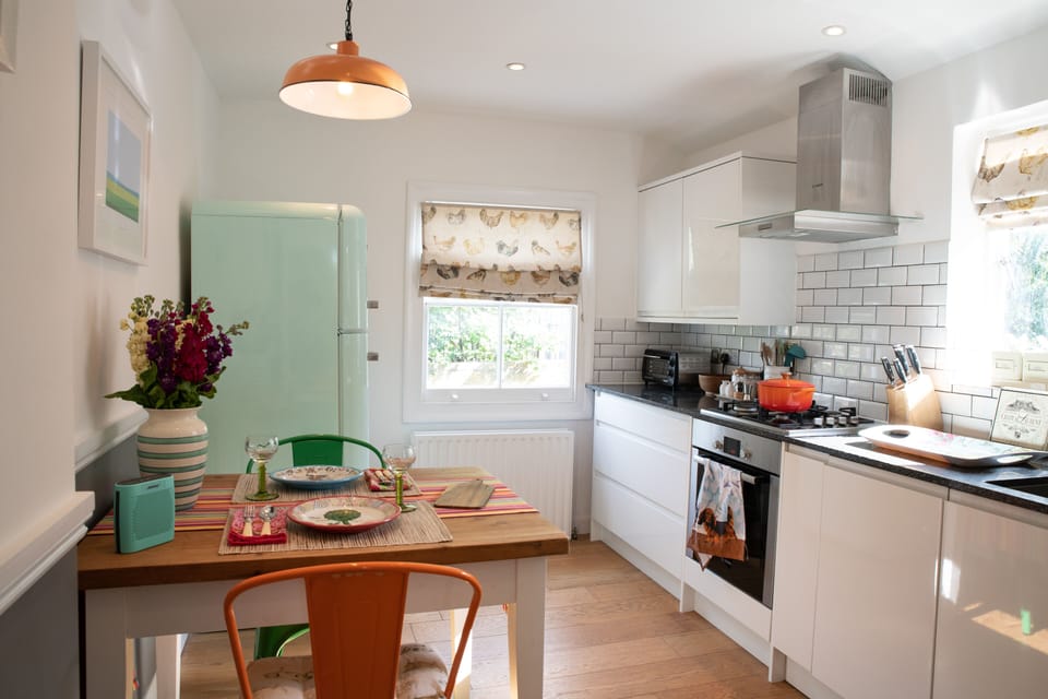 Renovated kitchen with Smeg fridge-freezer.