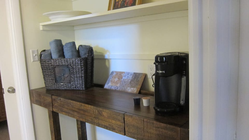 Hall between kitchen, BR with storage shelves