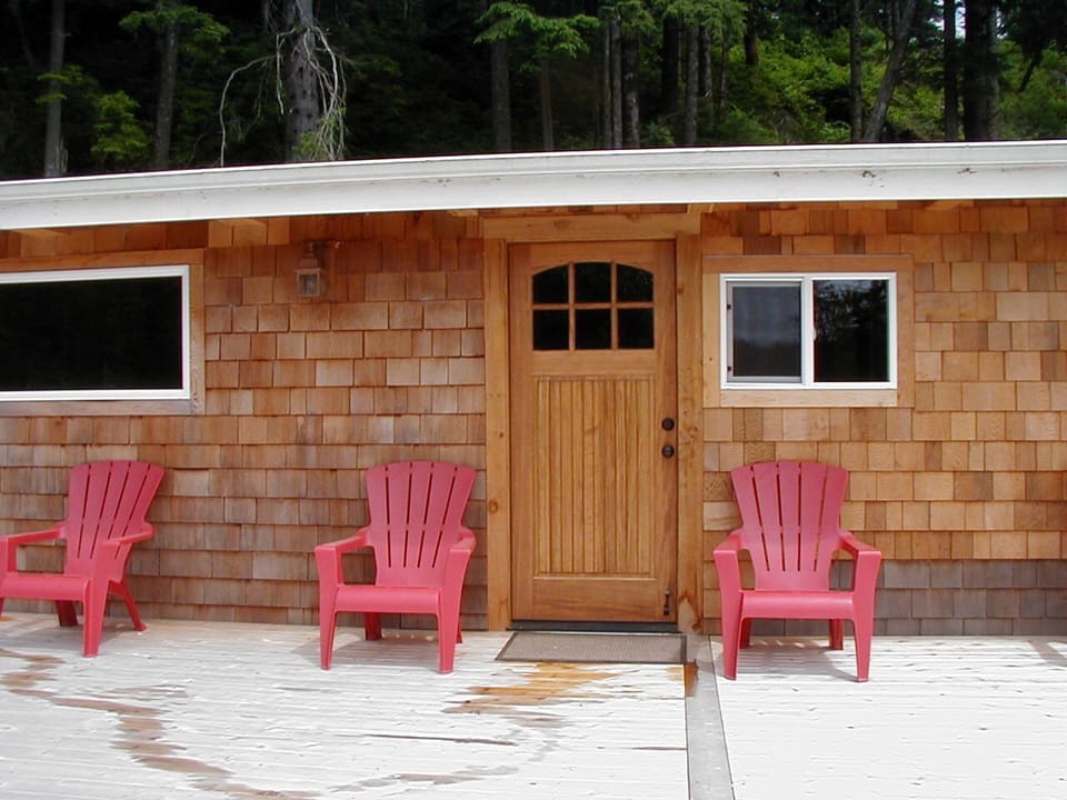 cedar shingle siding, new windows, new deck and comfortable Adirondack chairs.
