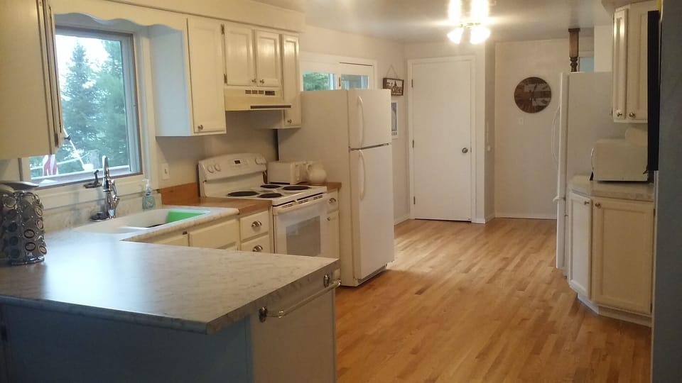 Kitchen
Has 2 (empty) Refrigerator/freezer spaces. There is no dishwasher.