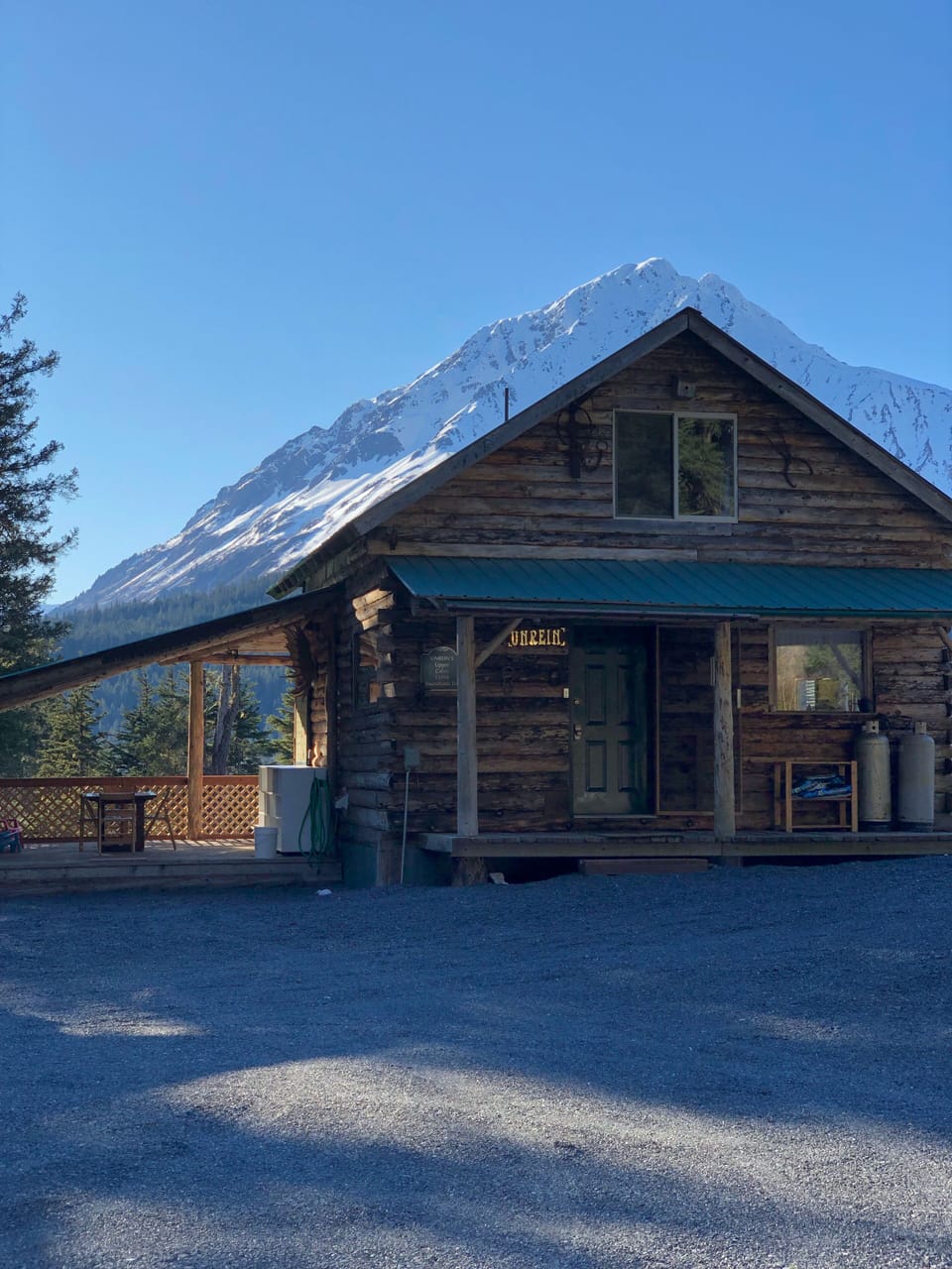 Cabin exterior view Mountain peaks in the background