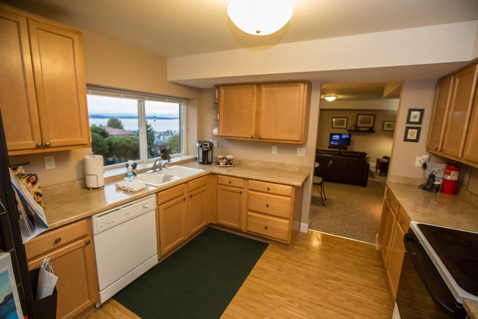 Even the kitchen has a view of Puget Sound. Note the dishwasher and coffee maker
