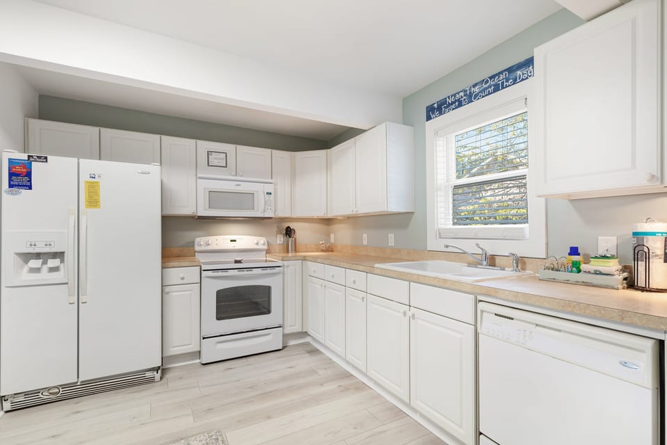 Open kitchen area with plenty of counter space to accommodate your cooking needs