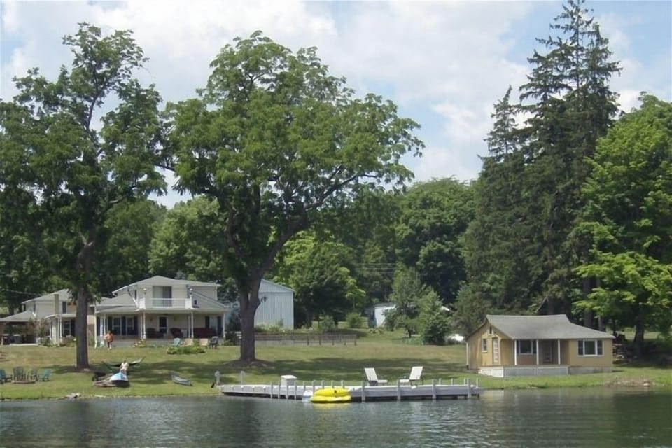 Beautiful Keuka Manor from the lake with the "honeymoon cottage" (priced separat