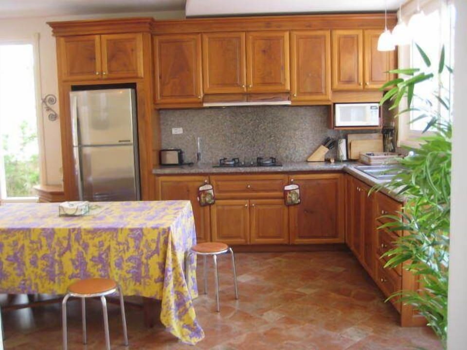 Brand new kitchen with granite counter top and wood cabinet