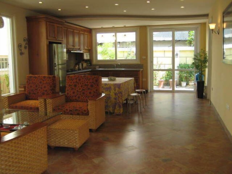 Open brightly lit kitchen and living room. This is perfect for entertainment