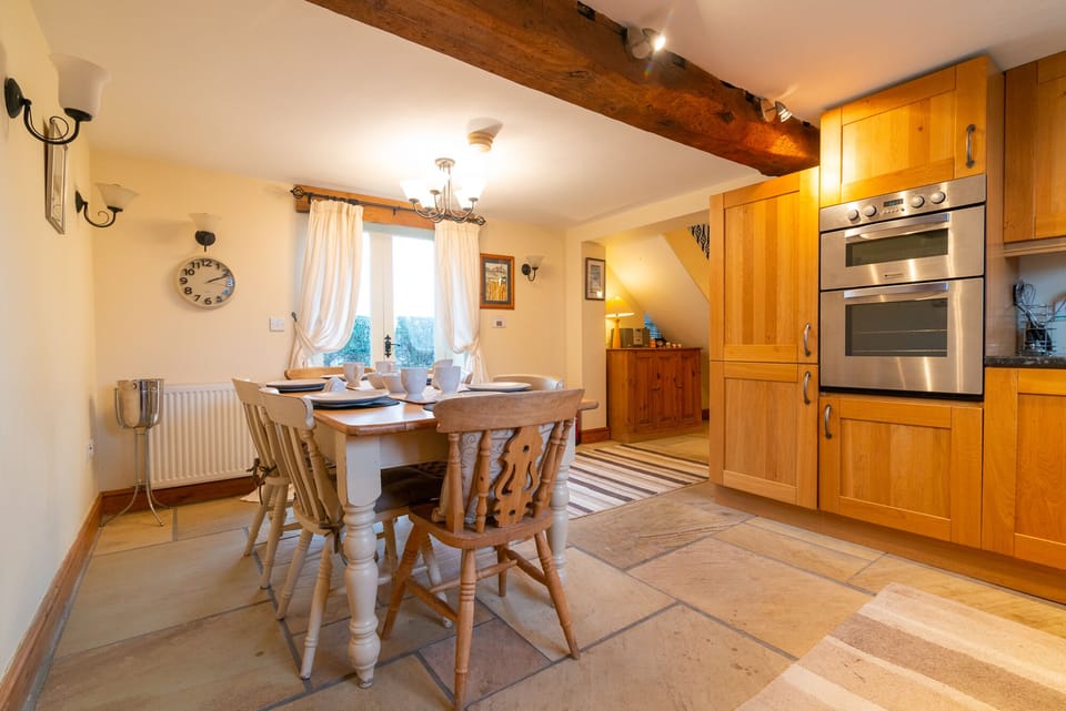 Spacious kitchen diner with french windows accessing patio