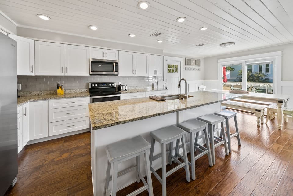 Cook memorable meals in your bright, modern kitchen featuring granite counters and island seating for gathering.