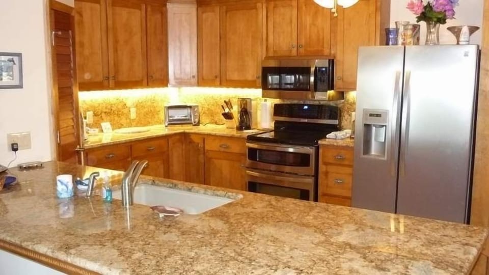 Everybody likes to gather in the kitchen. Plenty of room to cook or entertain.