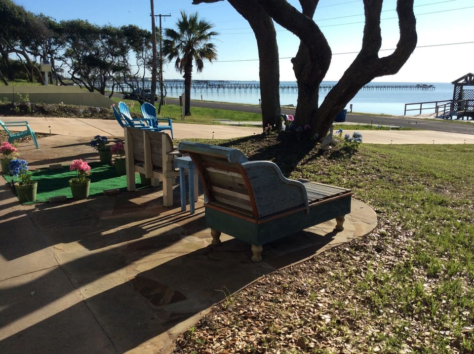 Flagstone patio for relaxing, enjoying morning coffee or watching Dolphins play