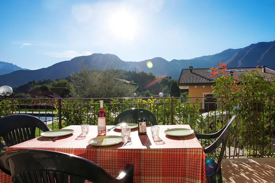 The terrace overlooks the pool to the left