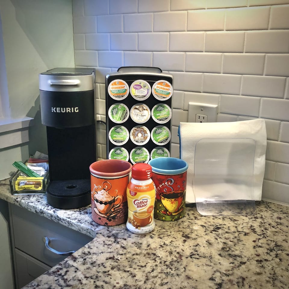 Enjoy a Keurig Coffee maker with a K-Cup supply and necessities.