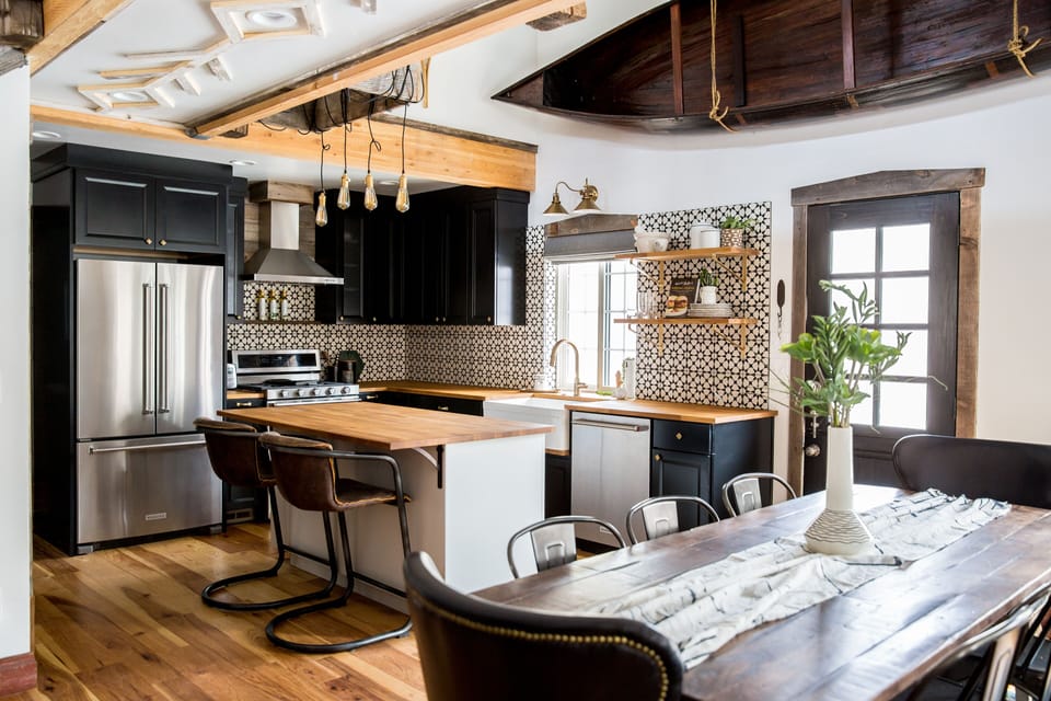 Dining area with seating for 8 and door to back deck overlooking the river 