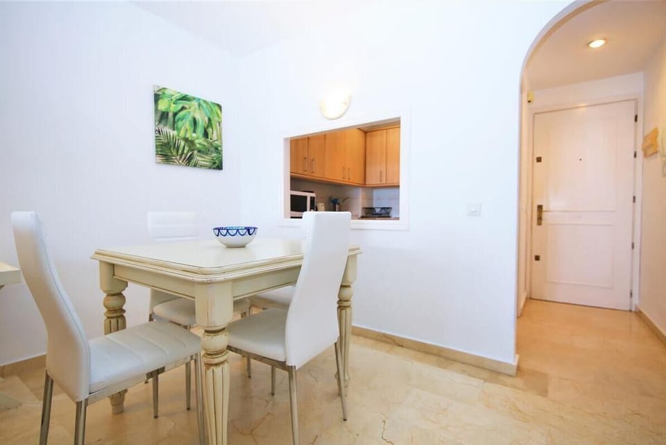 Dining area for four guests next to the kitchen