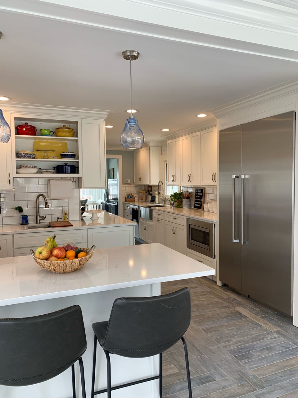 Kitchen with two sinks and Thermador refrigerator and freezer 