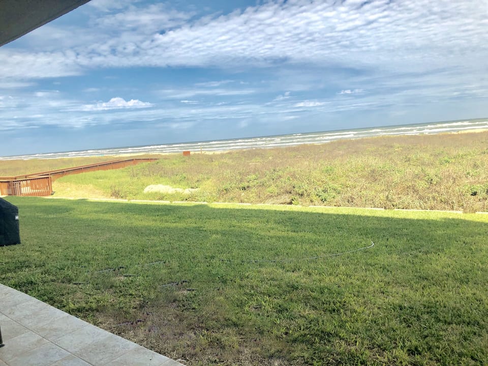 View of the boardwalk to the beach from our back patio.