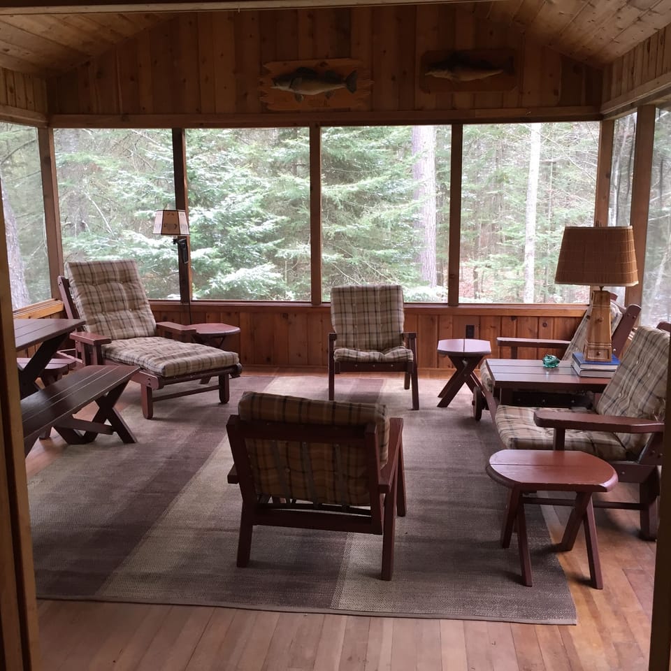 Screen Porch in Main Cottage with woods and lake views