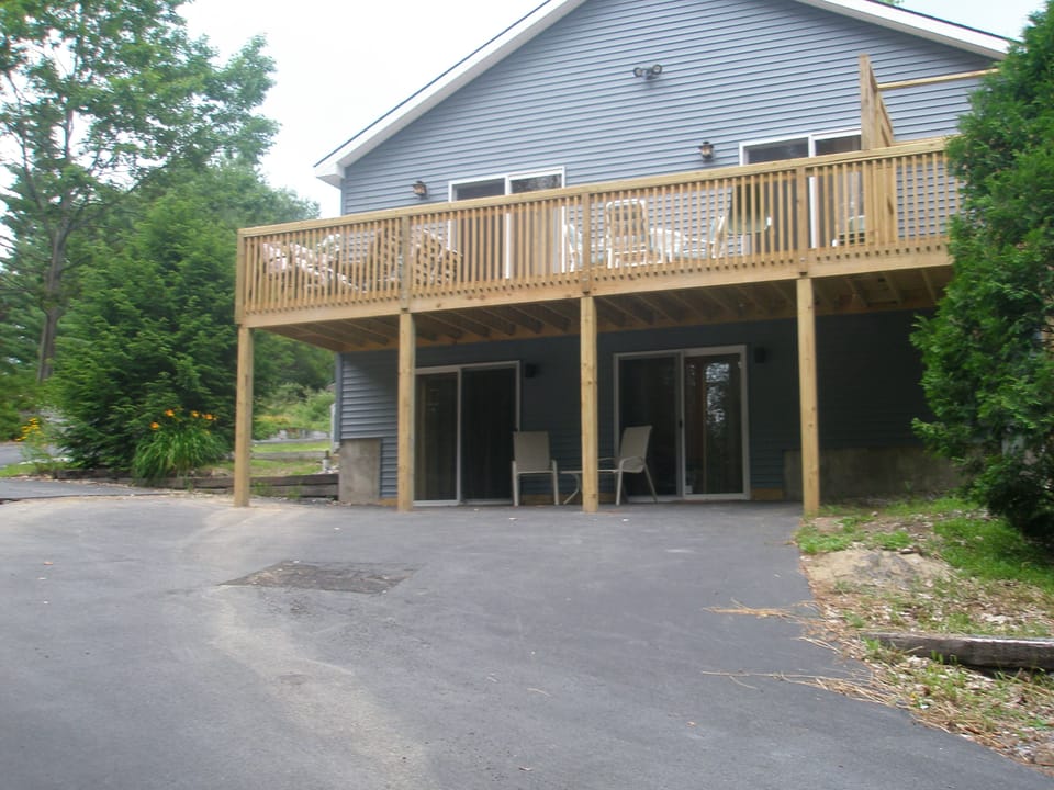 Side view of the house showing the large deck with great views of the lake