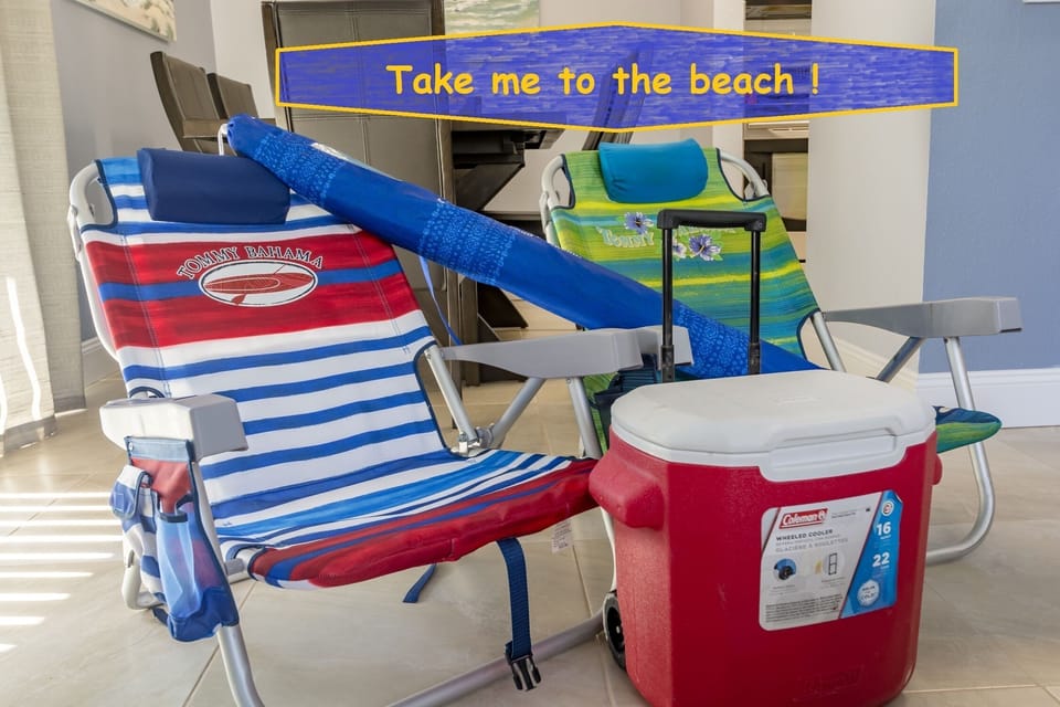 beach chairs, cooler and umbrella for the beach 