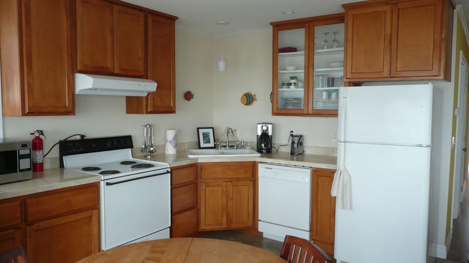 Plenty of counter space, cabinets and amenities. Newer stove than that shown!