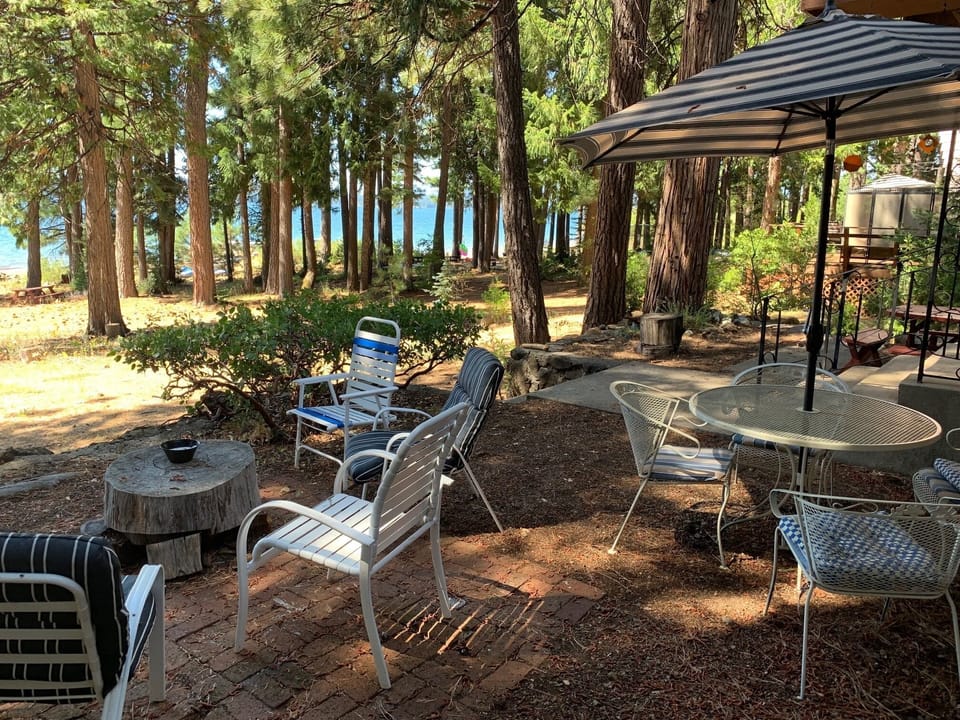 Patio from south, with sitting area and outdoor table w/chairs