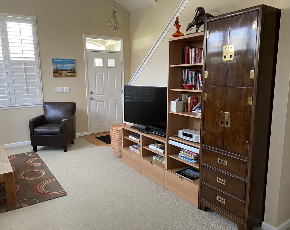 View from the dining area to all the great books you can read and the smart tv 