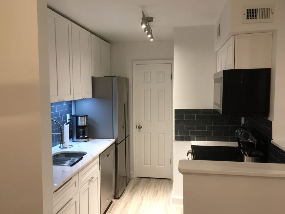 Stainless appliances, soft close cabinets, granite countertops, led lighting