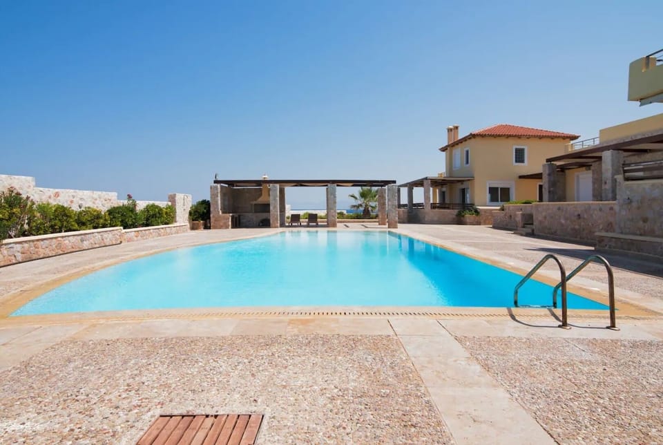 Large pool (among the largest on the island) and our villa in the backround. 