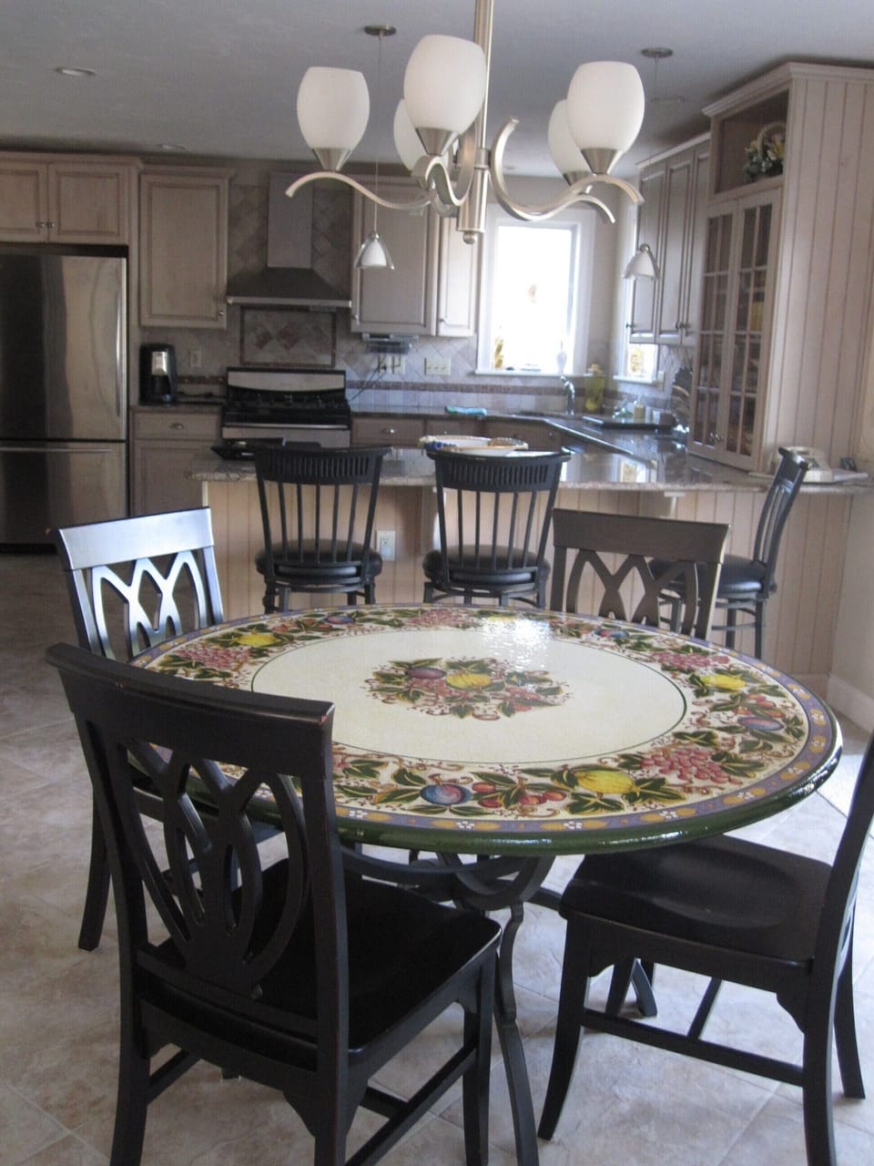 Gourmet kitchen with granite countertops and stainless appliances.  Large fridge