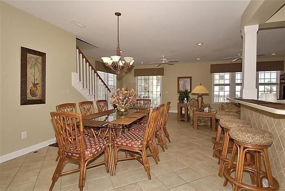 Large dining table with additional seating at the breakfast bar