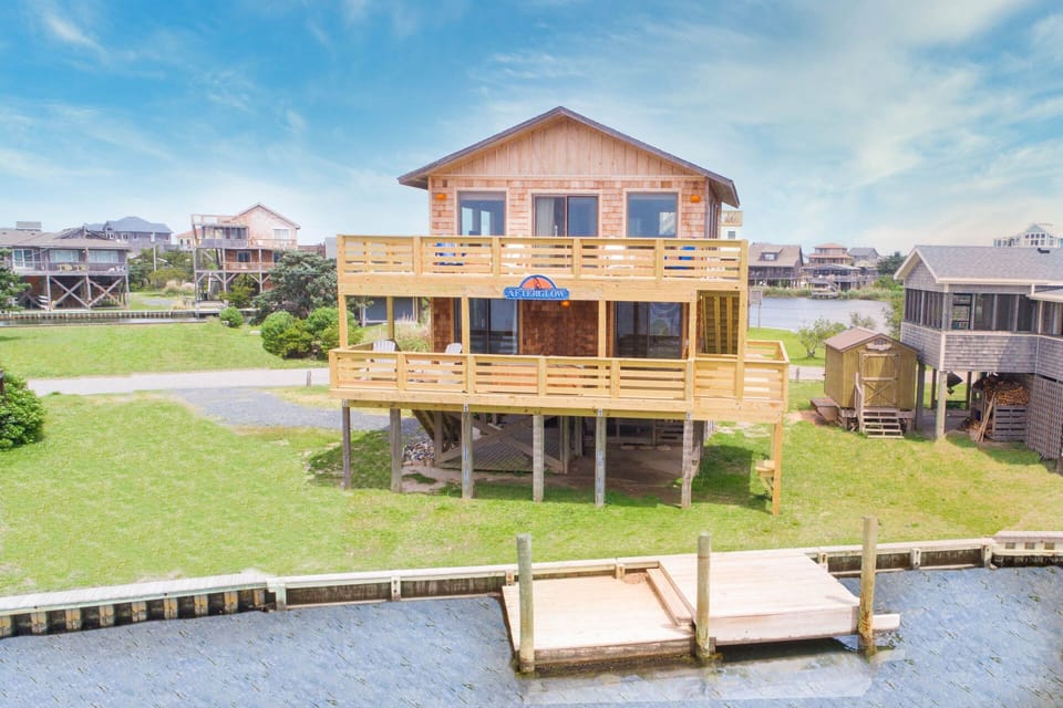 Bask in the AFTERGLOW of the stunning sunsets from the decks of this brightly decorated home.