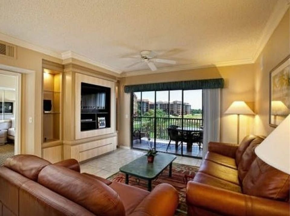 Queen sleeper sofa in the separate living area with large flat screen TV